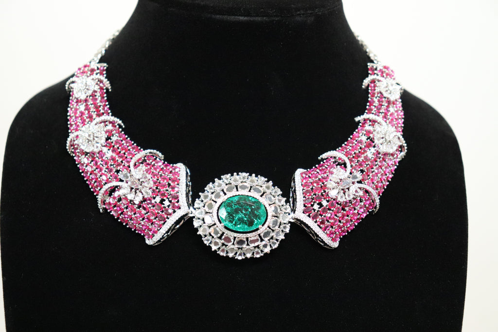 AD Ruby and Emerald Statement Necklace with dense pink stone setting and emerald centrepiece