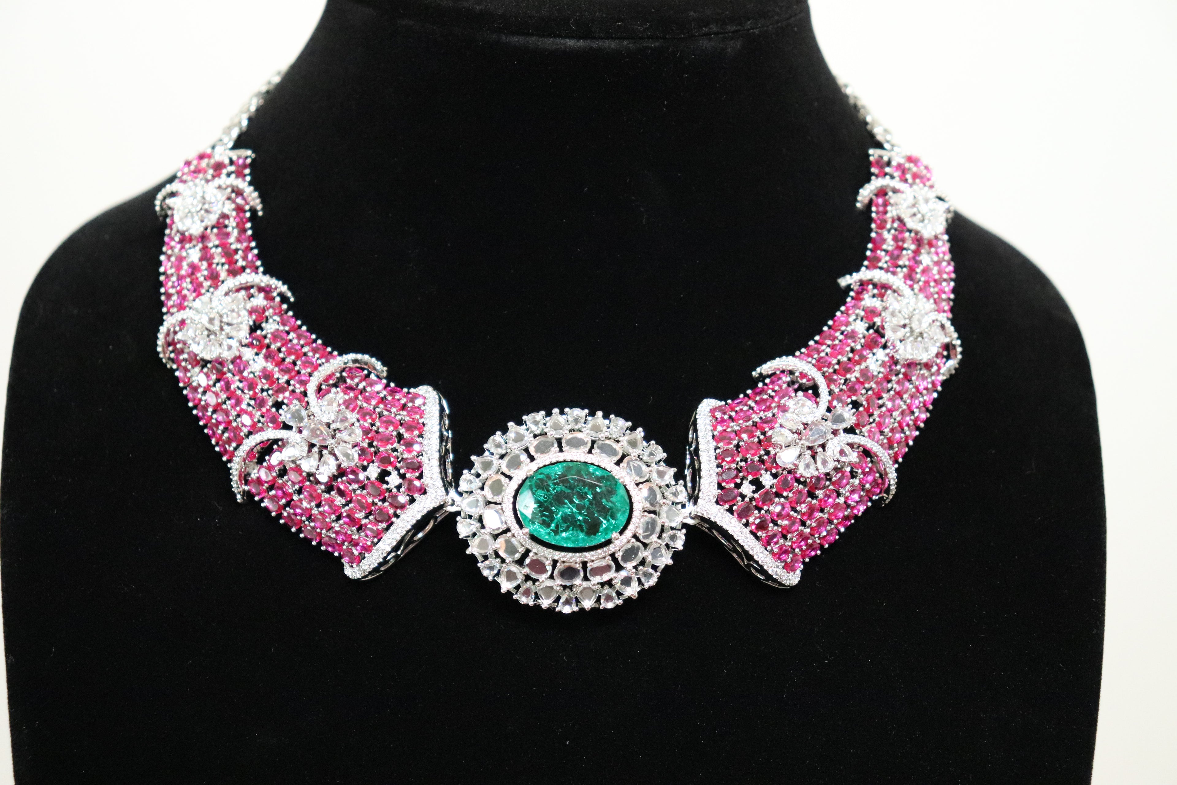 AD Ruby and Emerald Statement Necklace with dense pink stone setting and emerald centrepiece